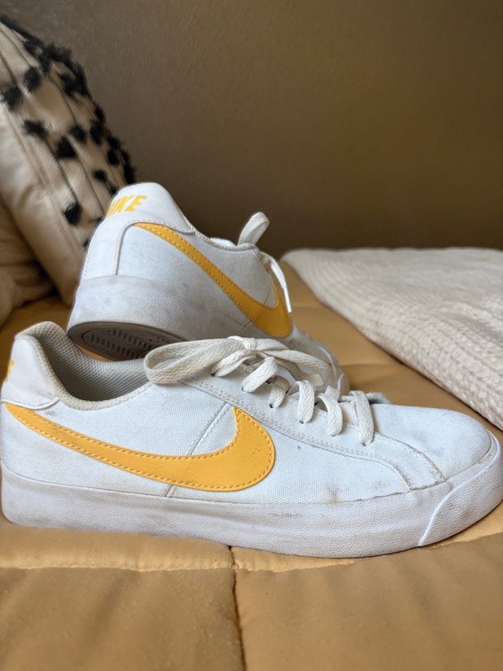 Nike White Canvas Sneakers with Yellow Swoosh Accent